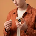 q86-camera-earbuds-on-model-hand.webp